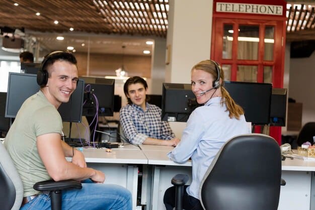 A team of customer service agents collaborating in a call center environment, utilizing advanced CRM software integrated with social media monitoring tools. The scene depicts real-time data analysis, efficient communication, and a focus on personalized customer interactions across various social media channels.
