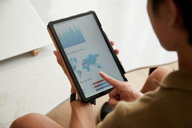 A close-up of a person holding a tablet, with analytics dashboards displayed on the screen. The dashboards show various metrics such as demographics, engagement rates, and user behavior patterns. The person is analyzing the data with a focused and thoughtful expression.