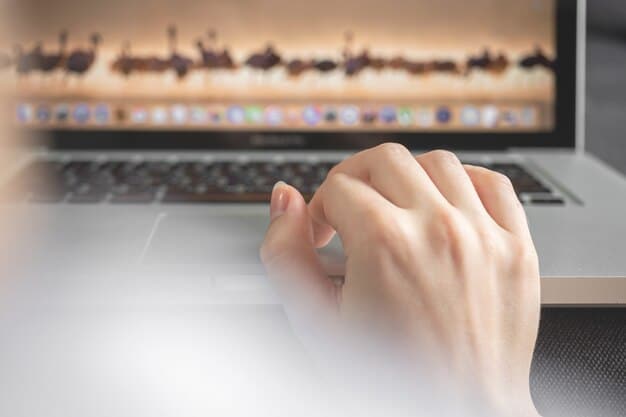 A close-up shot of a person's hands typing on a laptop, with a blurred background showing various social media icons. The focus is on the action of creating engaging content.